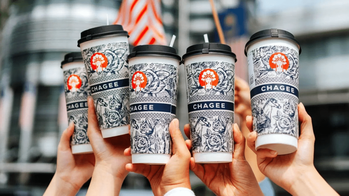 Hands holding up drinking cups from chagee