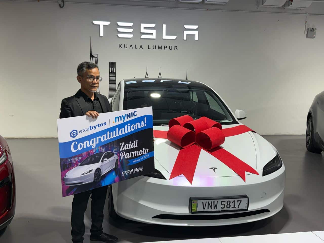 Zaidi-Parmoto-Founder-of-Myoutdoor.com-Sdn.-Bhd-winner-of-the-giveaway-walking-away-with-the-Tesla-Model-3