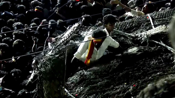 Video-Shows-Teens-Ripping-Out-Roof-Of-Hut-To-Escape-Crowd-Crush-At-Vijay-Rally