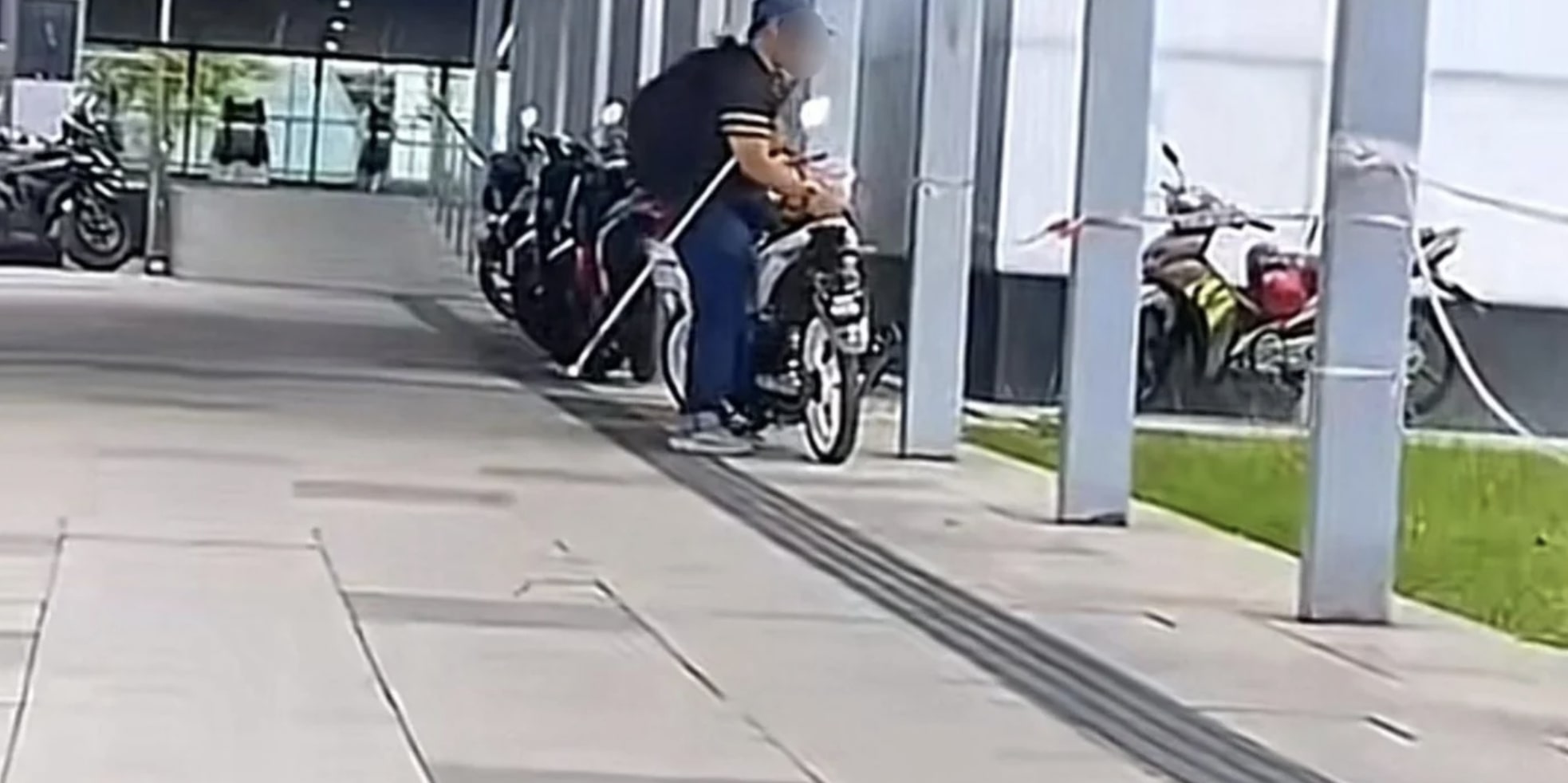 Netizens-Fume-After-Blind-Man-Forced-To-Move-Motorbikes-Blocking-Walkway